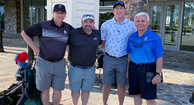 Photo of foursome at golf outing